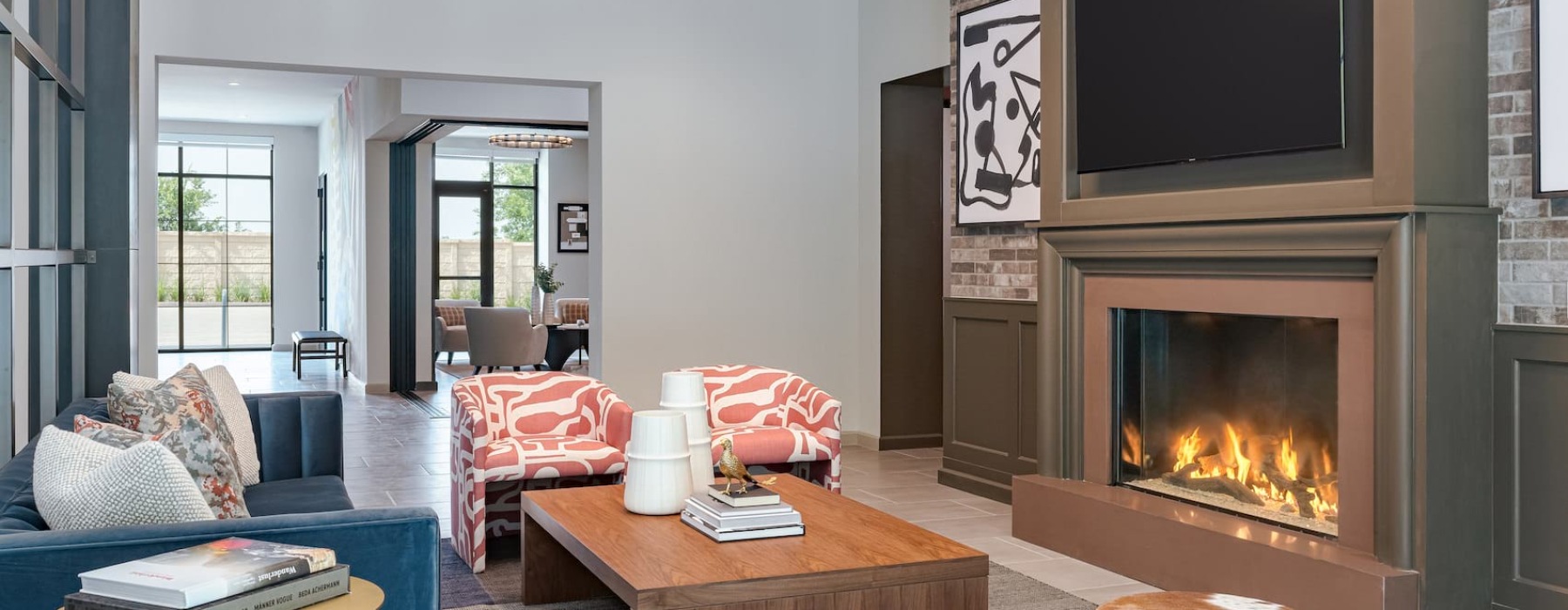 Beautiful clubroom with lounge seating and fireplace